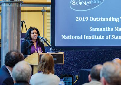 Samantha Maragh speaks on stage after receiving the State of Maryland Outstanding Young Scientist Award 2019.